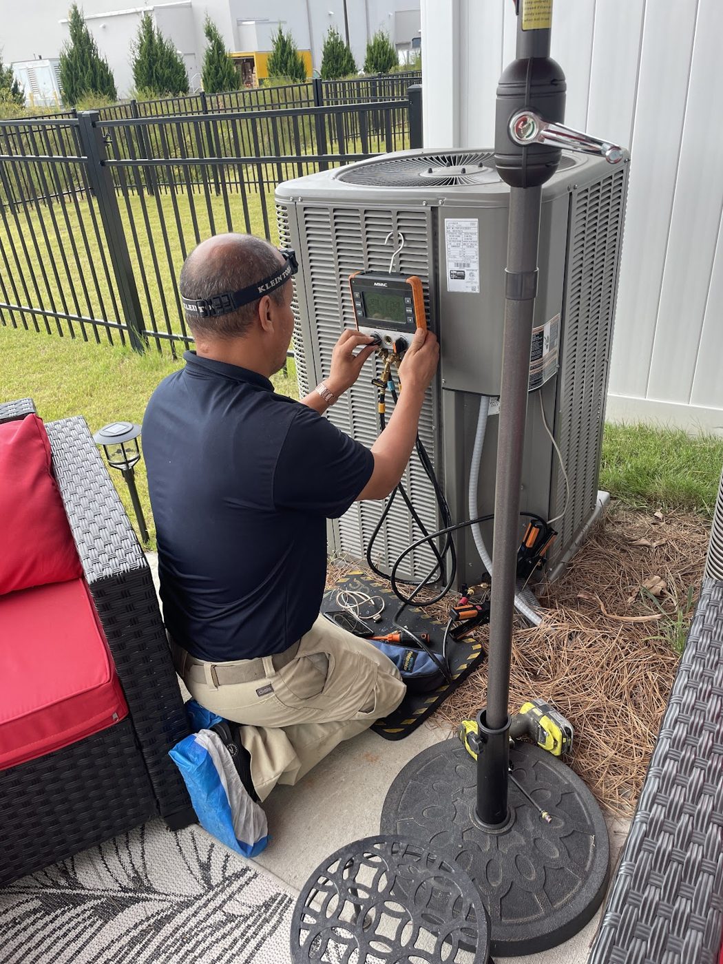 RGP technician checking a condenser